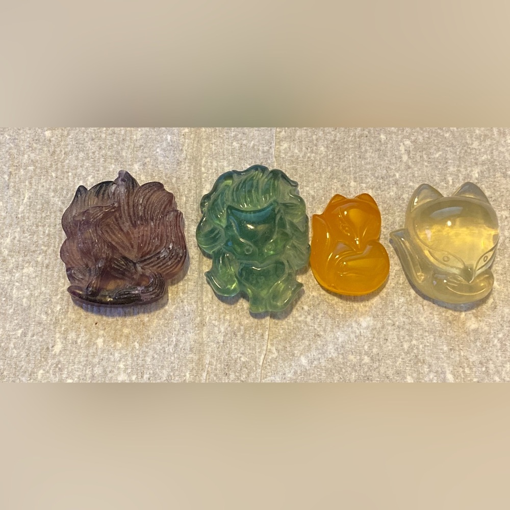 4 piece stone carvings, 1 wolf and 3 foxes